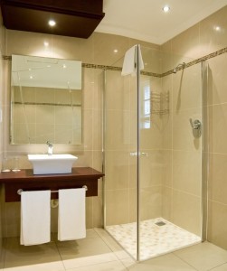 Gorgeous bathroom renovation in Canberra with porcelain tiling with frameless screen and wall hung vanity